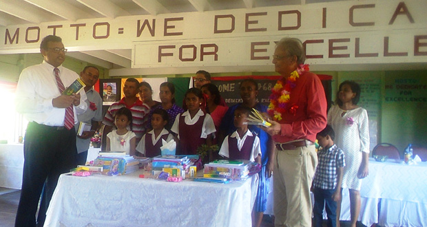 Dr. Surendra Persaud and family as well as  Minister of Education Dr. Rupert Roopnaraine with parents and recipients of the scholarships at the No. 68 Primary School