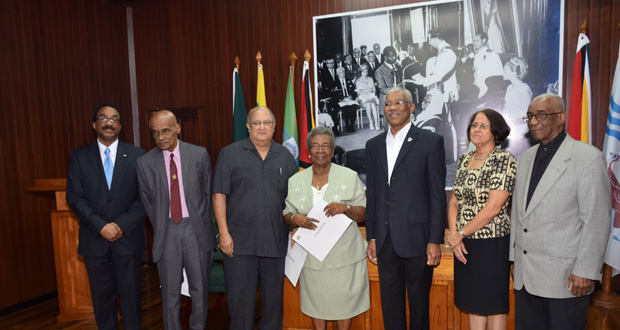 President David Granger being flanked by the newly appointed members of the Advisory Council on the Prerogative of Mercy. From left are: Attorney-General and Minister of Legal Affairs, Basil Williams; Justice Duke Pollard; Mr Carl Hanoman; Ms Yvonne Harewood-Benn; President David Granger; Ms Merle Mendonca; and Justice James Patterson