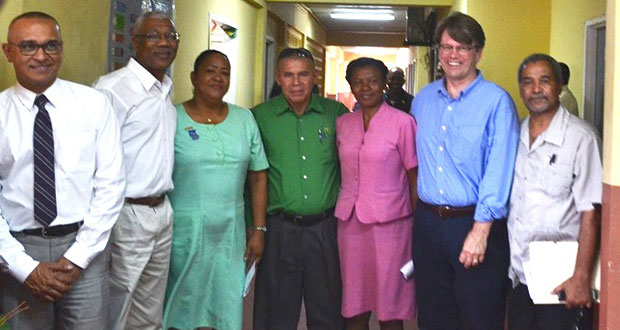 President David Granger (second left) and Public Health Minister Dr George Norton (centre) pose with staff of the Bartica Regional Hospital and other medical professionals following the unveiling of key facilities at the hospital on Saturday