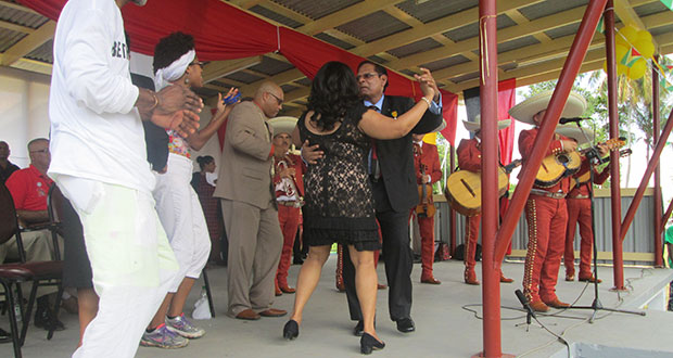 Prime Minister Moses Nagamootoo and one of his daughters dance to Mexican music