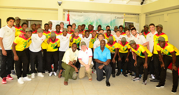 Members of the Guyana National Team share a moment with their Canadian counterparts ahead of tomorrow’s game. In the front row kneeling are Director of Sport Christopher Jones, Canadian High Commissioner to Guyana Pierre Giroux and acting GFF president Retired Brig. Bruce Lovell (Adrian Narine photo)