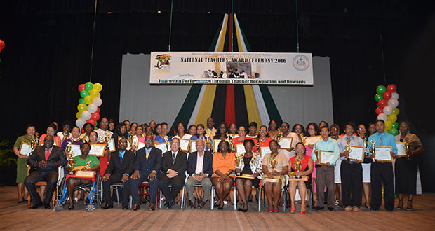 Awardees posing with Minister of Education, Dr. Rupert Roopnarine and other officials on Monday at NCC