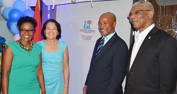 President Granger and First Lady Sandra Granger with the founders of EML, Dr Karen Boyle and her husband, microbiologist Andrew Boyle, after unveiling the plaque at the commissioning of Eureka’s new solar-powered building Saturday evening