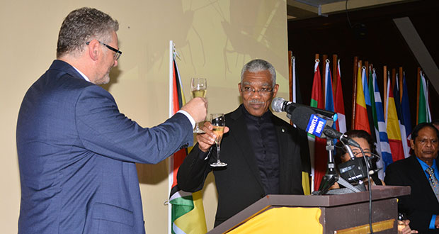 President David Granger shares a toast with EU Ambassador Jernej Videtic on Monday night in observance of Europe Day 2016 (Samuel Maughn photo)