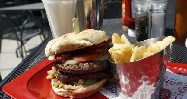 A meal of a ''Monster''-sized A.1. Peppercorn burger, Bottomless Steak Fries, and Monster Salted Caramel Milkshake is seen at a Red Robin restaurant in Foxboro, Massachusetts July 30, 2014.
