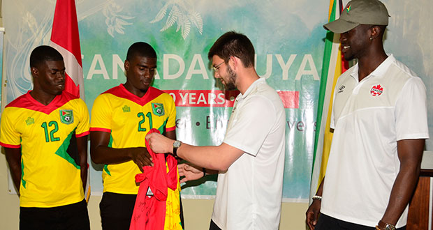 Captain Collin Nelson (second from left) exchanges a signed Golden Jaguars shirt with his Canadian counterpart Maxime Crépeau (Third from left). Guyana’s Dwight Peters (extreme left) looks on. (Adrian Narine Photo)