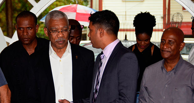 President of the Guyana Press Association (GPA) Neil Marks engages President David Granger on his arrival to address a training workshop for journalists last Friday. (Adrian Narine photo)