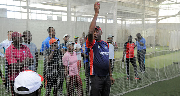 Former West Indies fast bowler, Tony Gray, demonstrates during yesterday’s session. (WICB Media/Randy Brooks)