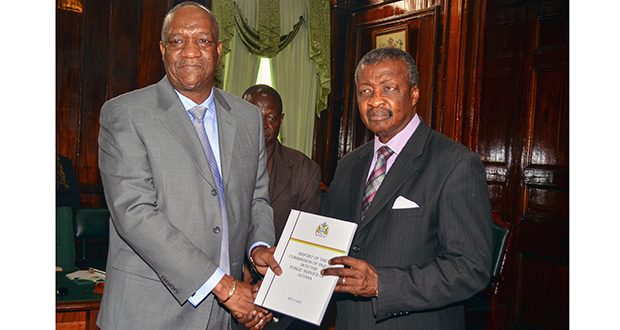 Minister of State, Joseph Harmon hands over the report into the Public Service to Speaker of the National Assembly Dr Barton Scotland on Wednesday in the presence of Clerk of the National Assembly, Sherlock Isaacs