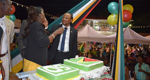 Minister of Housing Valerie Patterson and Member of Parliament Jermaine Figueira sharing a 50th Independence Anniversary Cake at the Linden, Region 10 Flag Raising Ceremony