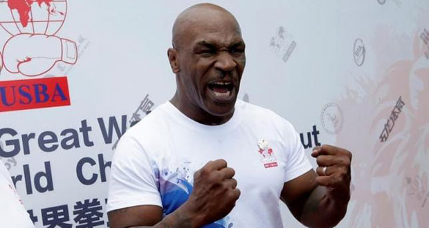 Former boxer Mike Tyson reacts as he speaks to the media, before the weigh-in of International Boxing Federation (IBF) World Championship Bout at the Mutianyu section of the Great Wall of China on the outskirts of Beijing, China, May 24, 2016.