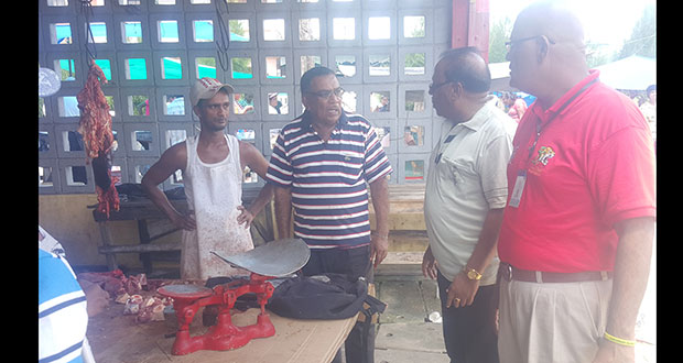 Region Six REO, Dr Veerasammy Ramayya, and the PM’s Region 6 Representative, Gobin Harbhajan (right), listened to a concerned vendor during their visit to the market yesterday