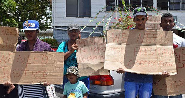 Davendra Persaud (second from right), and his family outside of the Ministry of the Presidency on Wednesday