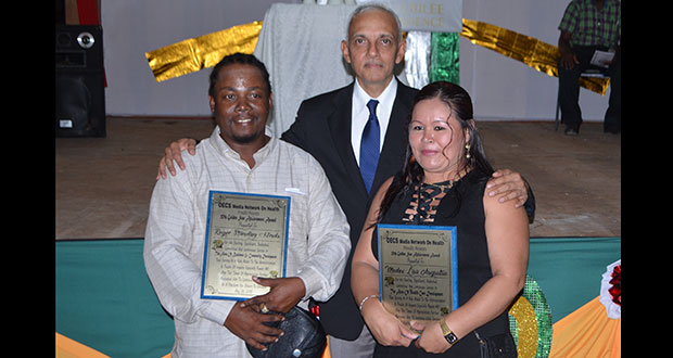 Minister Bulkan (centre) poses with businessman Roger Hinds and Medex Lisa Augustus
