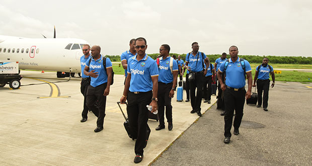 The West Indies team make their way to the team bus after arriving at the Eugene Correia International Airport.