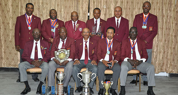 WIFBSC Short Range champs 2016, Guyana, display trophies and medals after winning the WIFB Short Range and Wadadli Cups as well as other Individual trophies and medals. Seated from right are Paul Slowe, Dylan Fields, Mahendra Persaud, Lennox Braithwaite and Ransford Goodluck. Standing from left are Peter Persaud, John Fraser, Terrance Stuart, Sherwin Felicien, Leo Romalho and Ryan Sampson.