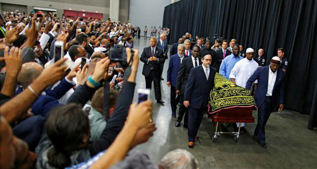 Worshippers and well-wishers take photographs as the casket with the body of the late boxing champion Muhammad Ali is brought for his jenazah, an Islamic funeral prayer, in Louisville, Kentucky, U.S. yesterday. (Reuters/Carlos Barria)
