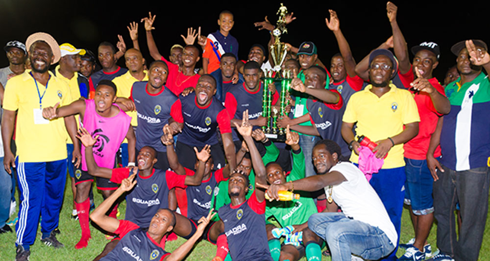 Elite League Champions Alpha United display winning trophy. (Delano Williams photos)