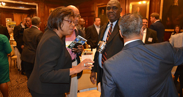 Minister of Telecommunications Cathy Hughes (left) interacts with attendees at the Investment Conference in New York, USA