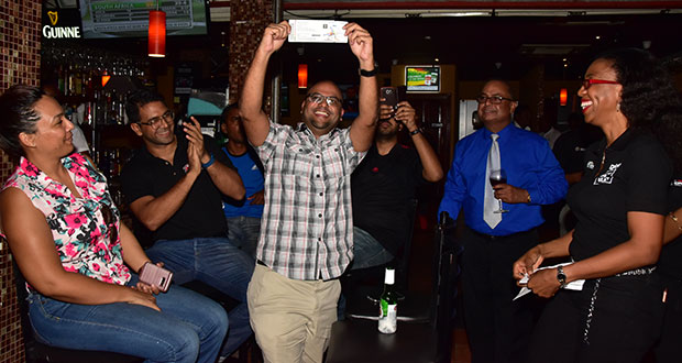 At Palm Court, a patron Navin Prashad displays a ticket he won after his phone was checked and he has an active 4G data plan, compliments of Digicel