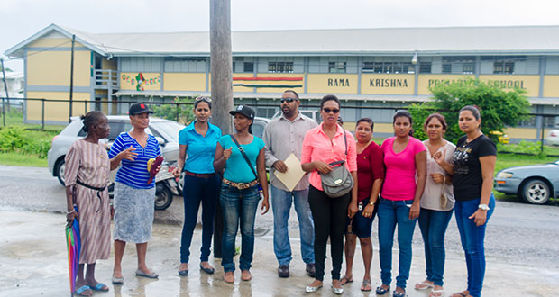 President of the PTA, Gary Foo, along with other members of the school’s PTA, concerned parents and patron vendor protest outside the Rama Krishna Primary School
