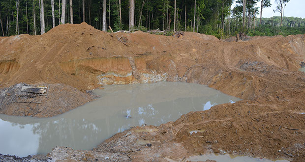 The pit from which the lifeless body of 18-year-old Ramal Williams was pulled  last Sunday in Konawaruk Backdam