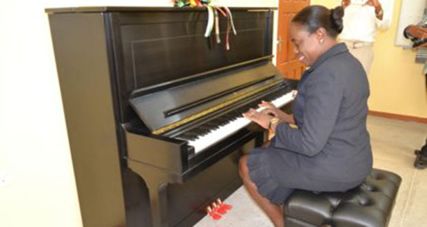 Minister within the Ministry of Education, Nicolette Henry showing her skills on one of the pianos on Monday