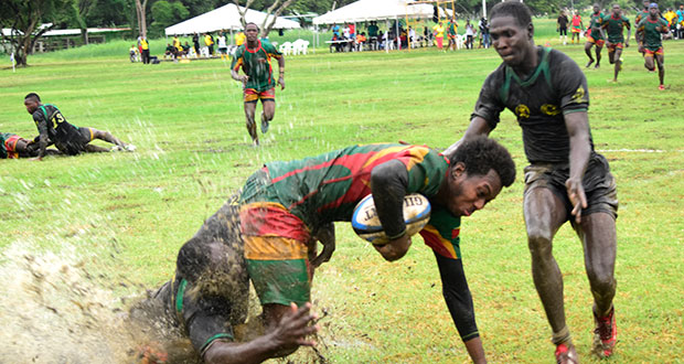 A Guyanese player is taken down brutally during the Green Machine’s game against Jamaica in the National Park last month.