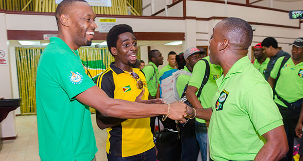 Director of Sport Chris Jones (left) shares a light moment with Green Machine Team manager Robbie Roberts (right) (Delano Williams Photo)