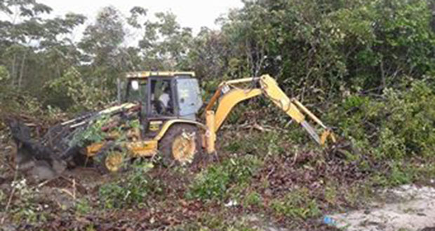 Contractors have begun clearing the vegetation to begin installing electrical cables at Bamia, Soesdyke-Linden Highway