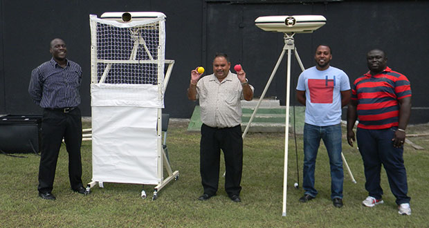 GCB’s Colin Stuart and Drubahadur with the newly acquired bowling machines.