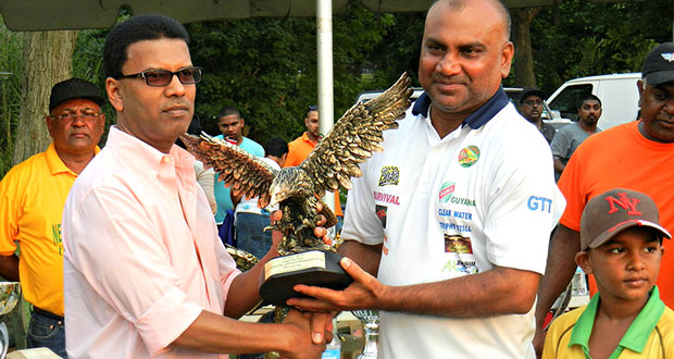 FLASHBACK:  Guyana Floodlight Softball Cricket Association (GFSCA) captain Ricky Deonarine collects the Eagle for winning the 2015 Legends Championship from sponsor Johnny, of Johnny’s Restaurant & Bar.