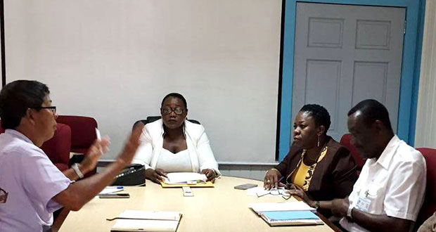 Minister Broomes, centre, in discussion with GGMC Chairman Stanley Ming (left), MARAD Director Claudette Rogers (second right) and Harbour Master Michael Tennet (right)