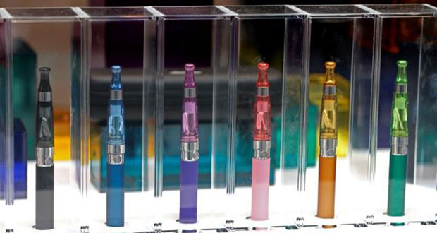 A window display with different colour models electronic cigarettes is seen in a shop in Paris