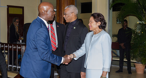 Trinidad and Tobago Prime Minister, Dr Keith Rowley greets First Lady Sandra Granger. Second right is President David Granger