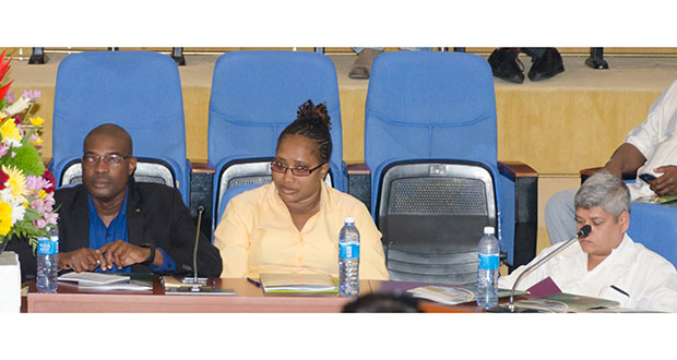 Minister of Public Infrastructure David Patterson; Minister within the Ministry of Infrastructure, Annette Ferguson; and Minister within the Ministry of Finance Jaipaul Sharma listen to contractors at Friday’s symposium