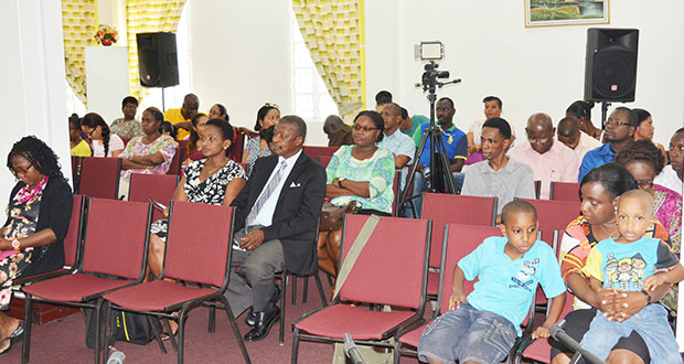 A section of the gathering at the Foundation 7 summer programme closing ceremony, held at the National Library Conference Room on Friday.  House Speaker Dr Barton Scotland and Mrs Scotland are seated at left in the second row