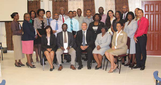 GRA’s Commissioner-General Godfrey Statia (seated centre) sits with staff of the Revenue Authority including Chairman of the entity’s board Rawle Lucas (seated second left) and Ingrid Griffith (seated second right)