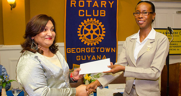 GRPA Executive Director, Patricia Sheerattan-Bisnauth (left) receives the donation from Rotary Club of Georgetown representative Lisa Foster