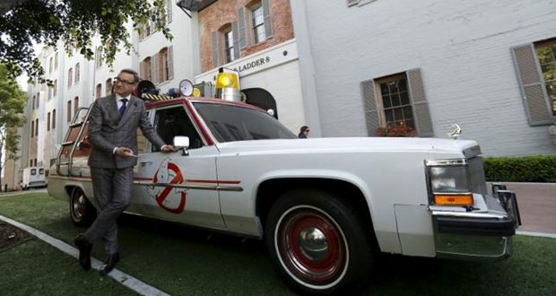 Director of the movie Paul Feig poses next to ECTO-1, the vehicle used in the upcoming movie ''Ghostbusters,'' during a photo-call at Sony Studios in Culver City, California March 2, 2016. (REUTERS/MARIO ANZUONI)
