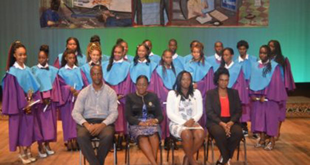 Minister within the Ministry of Education, Nicolette Henry (second from left), Permanent Secretary, Alfred King (right), and officials within the ministry along with students who graduated from the Youth Entrepreneurial Skills Training Programme
