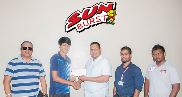 Avalon Jagnandan, Marketing and Sales Manager of Continental Group of Companies, hands over sponsorship cheque to National badminton champion Narayan Ramdhani in the presence of GBA president Mr Gokarn Ramdhani and Marketing representatives of the Sunburst Juice brand.