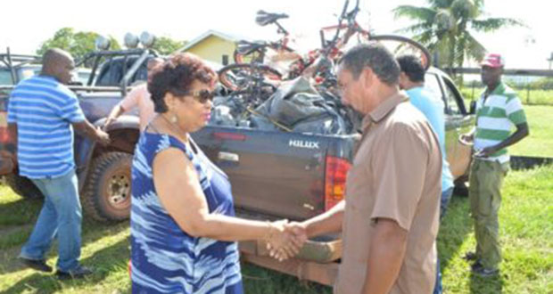 Social Cohesion Minister Amna Ally greets Toshao of Moco Moco, James George on her arrival at the Region Nine village