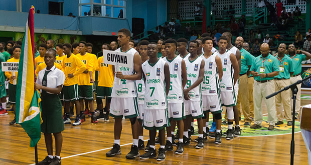 Guyana team pose after march past.