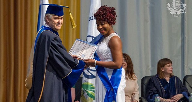 Patricia Anthony, who hails from Linden, Region 10 being presented her certificate after successfully reading for a Bachelor of Economics at the People’s Friendship University of Russia