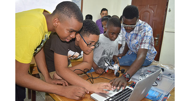 Students who participated in Thursday’s robotics workshop examining a robot’s software