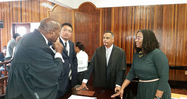 Attorneys Gino Persaud, Arif Bulkan and Tracy Robinson listen as attorney Nigel Hughes makes a point on Wednesday. The attorneys are all part of the appellant’s team in the cross-dressing appeal case. (Leroy Adolphus photo)