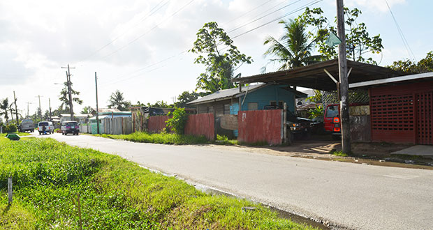 Houses erected by squatters along West Ruimveldt Front Road, Georgetown