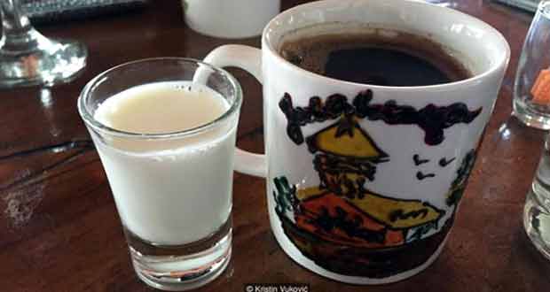 A glass of sweet donkey milk accompanies a cup of Turkish coffee (Credit: Kristin Vuković)