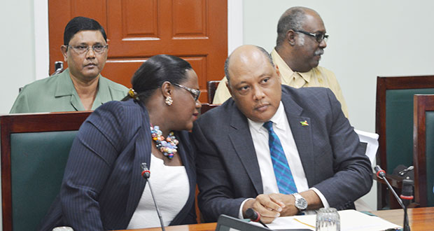 Minister within the Ministry of Natural Resources, Simona Broomes (front left) shares a word with Senior Minister Raphael Trotman prior to the start of the meeting of the Parliamentary Sectoral Committee on Natural Resources
Also in photo (L-R) James Singh, Commission of the Guyana Forestry Commission and acting Head of the Guyana Geology and Mines Commission, Newell Dennision